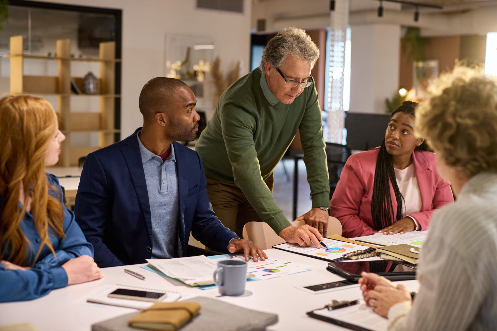 Professional team analyzing data in office